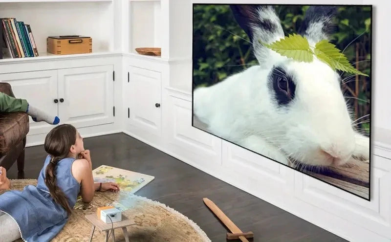 Supports HDMI, USB connection and uses high-definition projector YG300 home theater grade non occupying projector